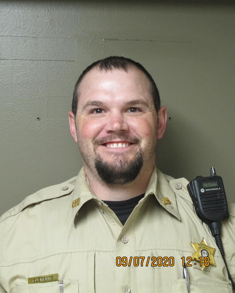 Deputy Caleb Clements smiles as his photo is taken.