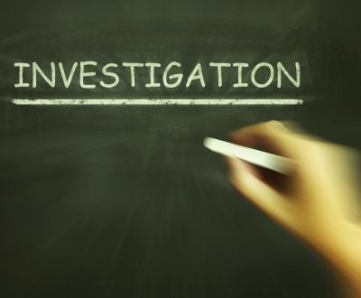 Investigation written on chalkboard