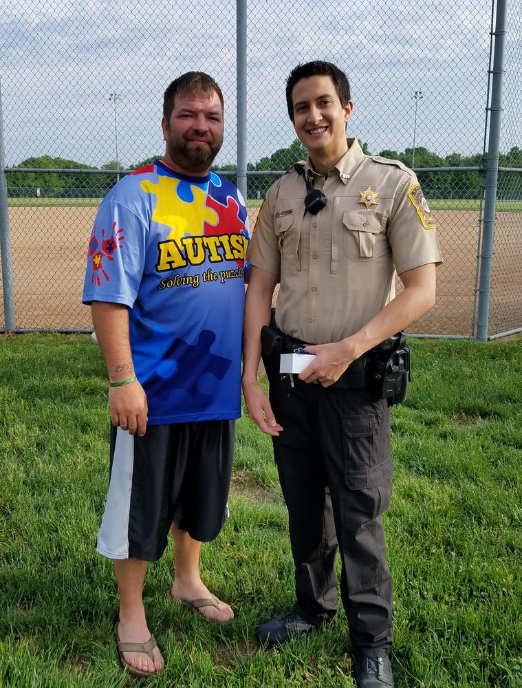 woelfle and man standing at ball fields