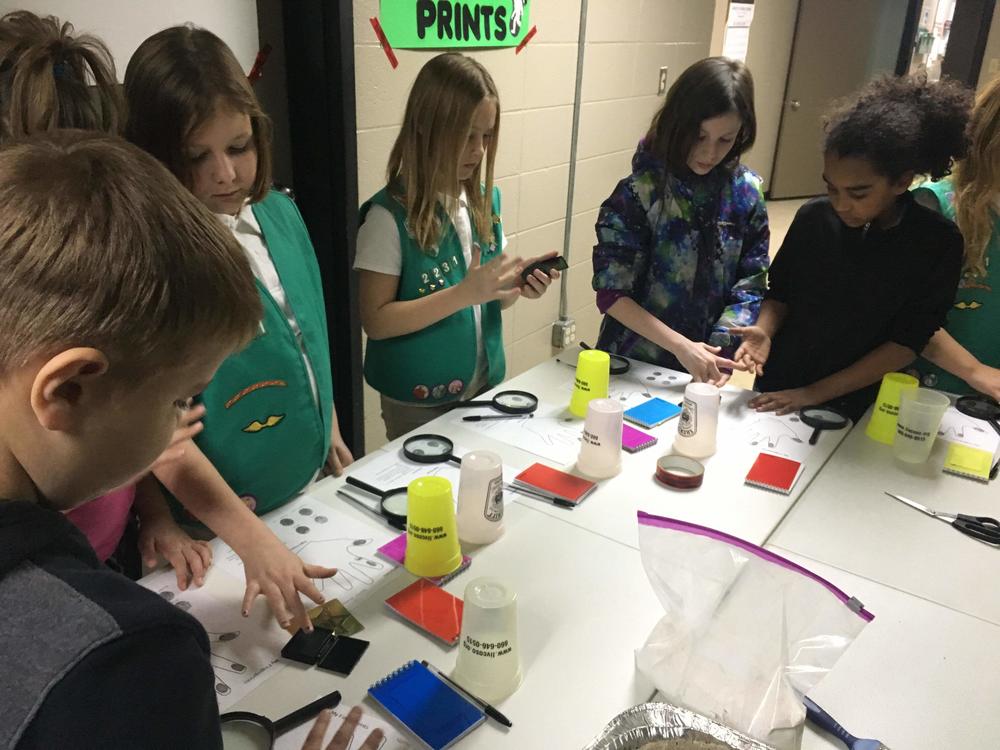 girl scouts at table