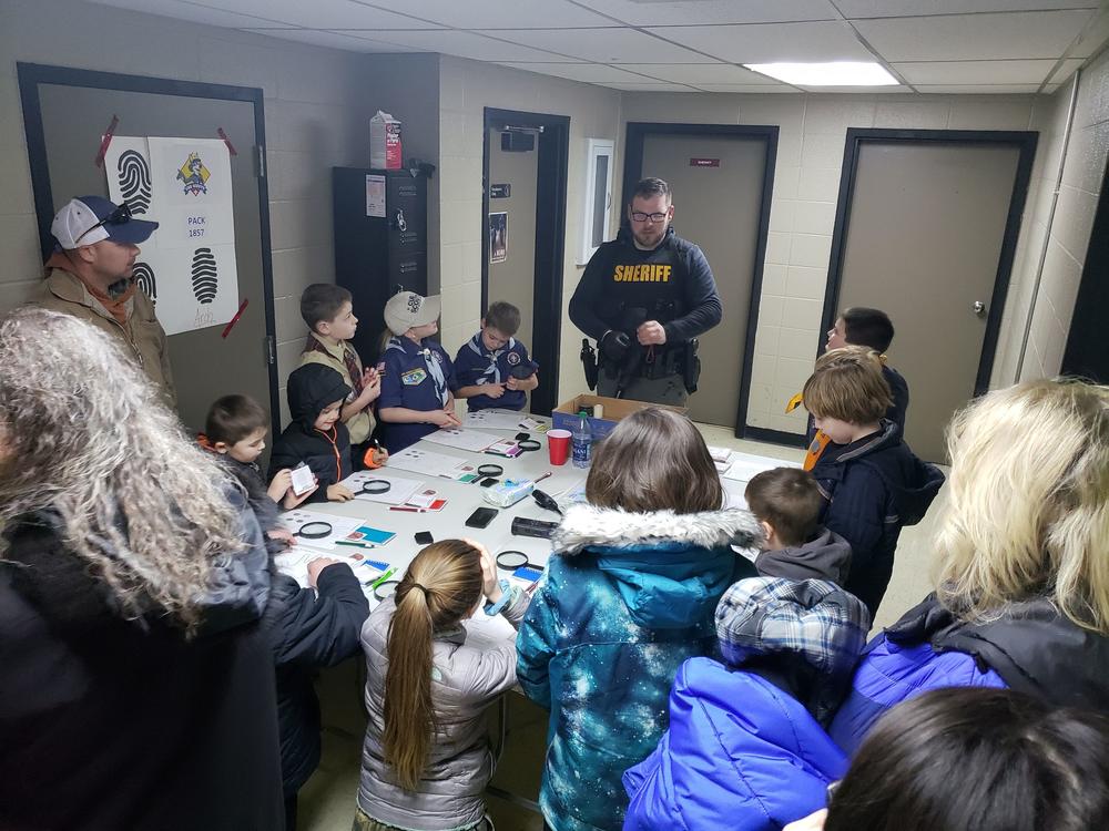 deputy discussing with scouts