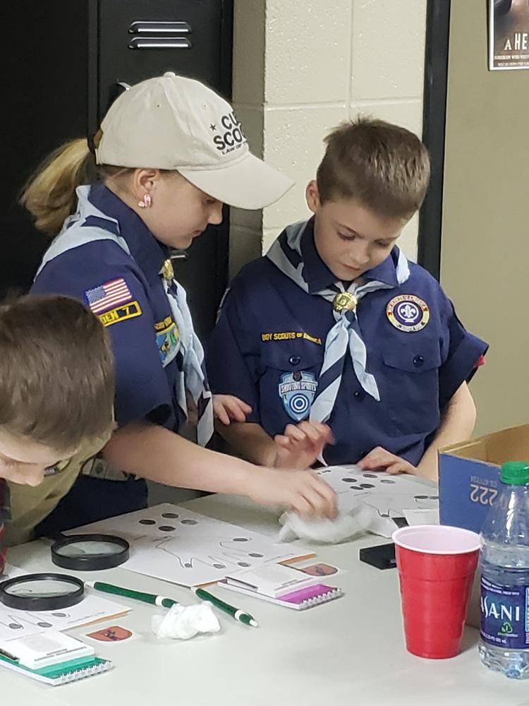 two scouts at table