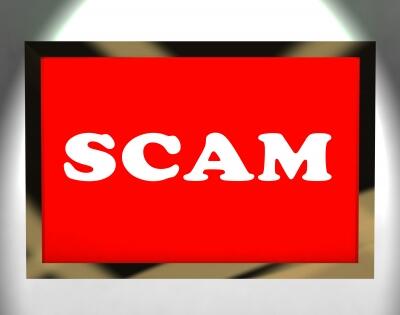 The word Scam written in big white letters on a bright red background.