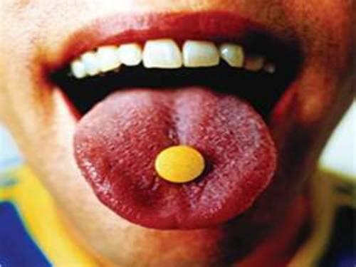 example pill on tongue
