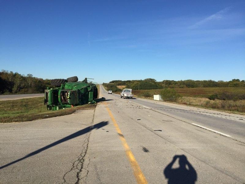 The green semi-tractor and trailer after the crash.